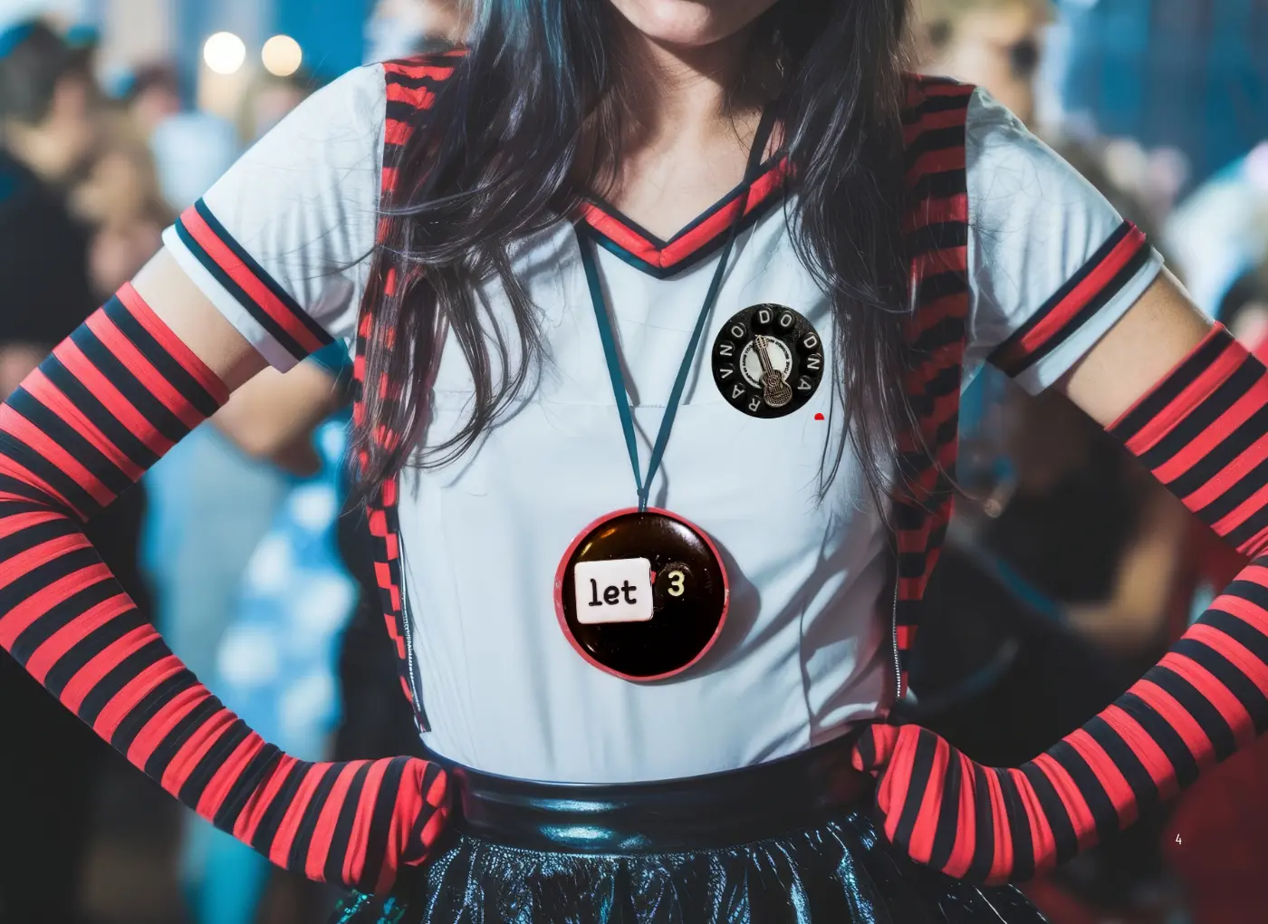 Cosplayer or performer wearing a white top with red-and-black striped sleeves, a round badge, and a large 'let' button necklace at a crowded event.