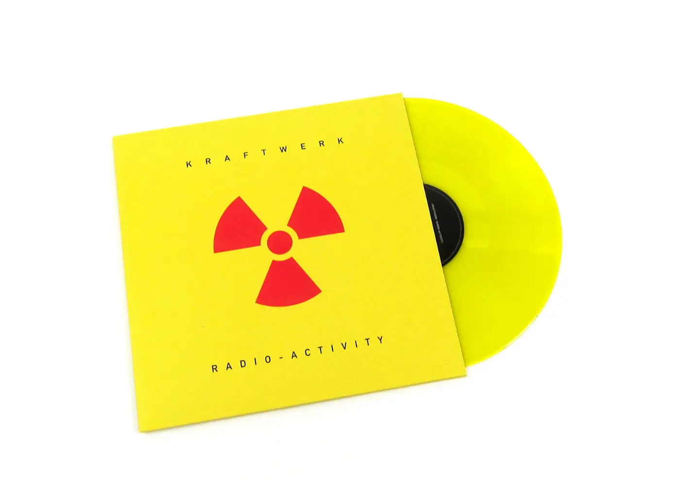 Bright yellow Kraftwerk 'Radio-Activity' vinyl sleeve with red radiation symbol and neon yellow vinyl partially showing out.