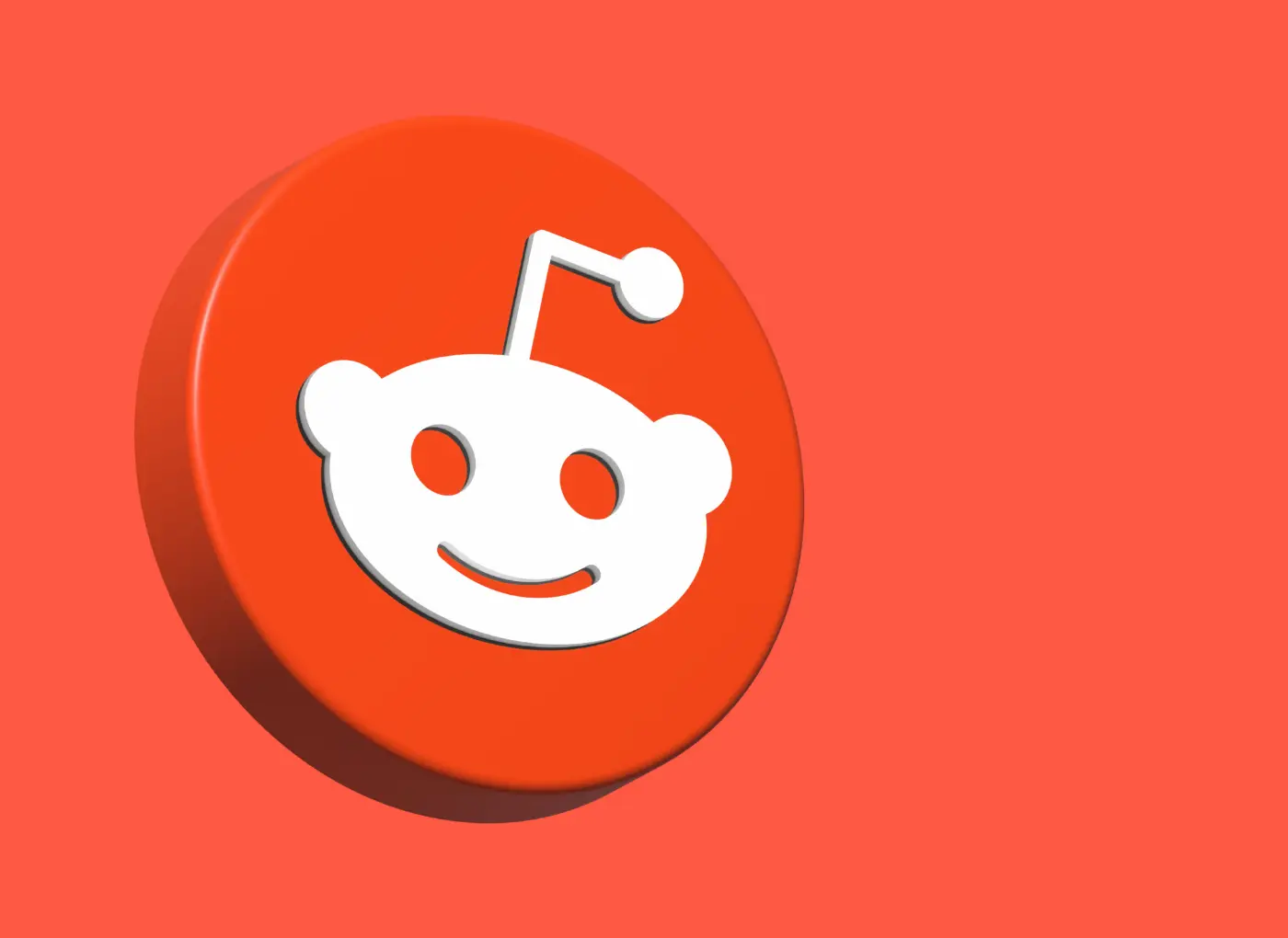 Reddit logo: white alien head on an orange circular badge against an orange background.