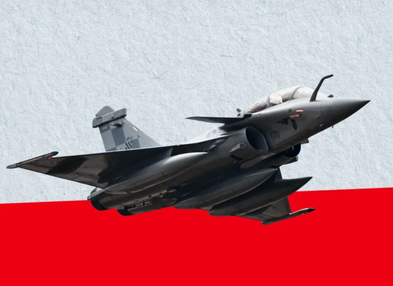 Gray fighter jet in level flight against a textured gray backdrop with a bold red lower band distant to the right.