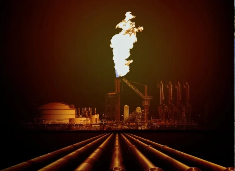 Nighttime oil refinery scene with a tall gas flare burning atop a structure, surrounded by piping and industrial equipment.